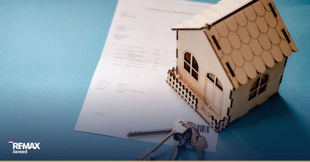Egyptian family reviewing house affordability calculations and floor plans with property consultant