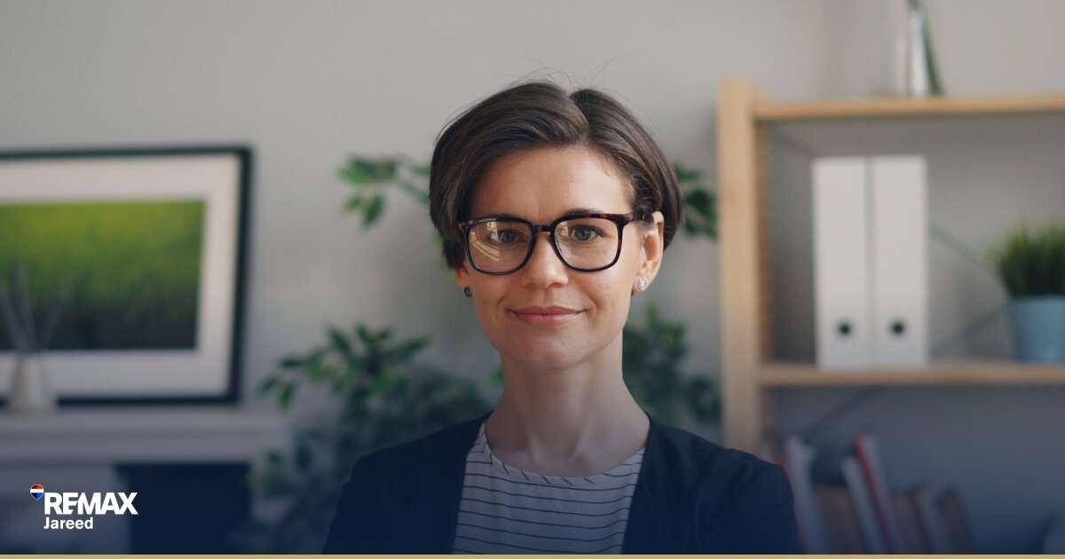 Professional property consultant reviewing growth metrics and commission statements on desk
