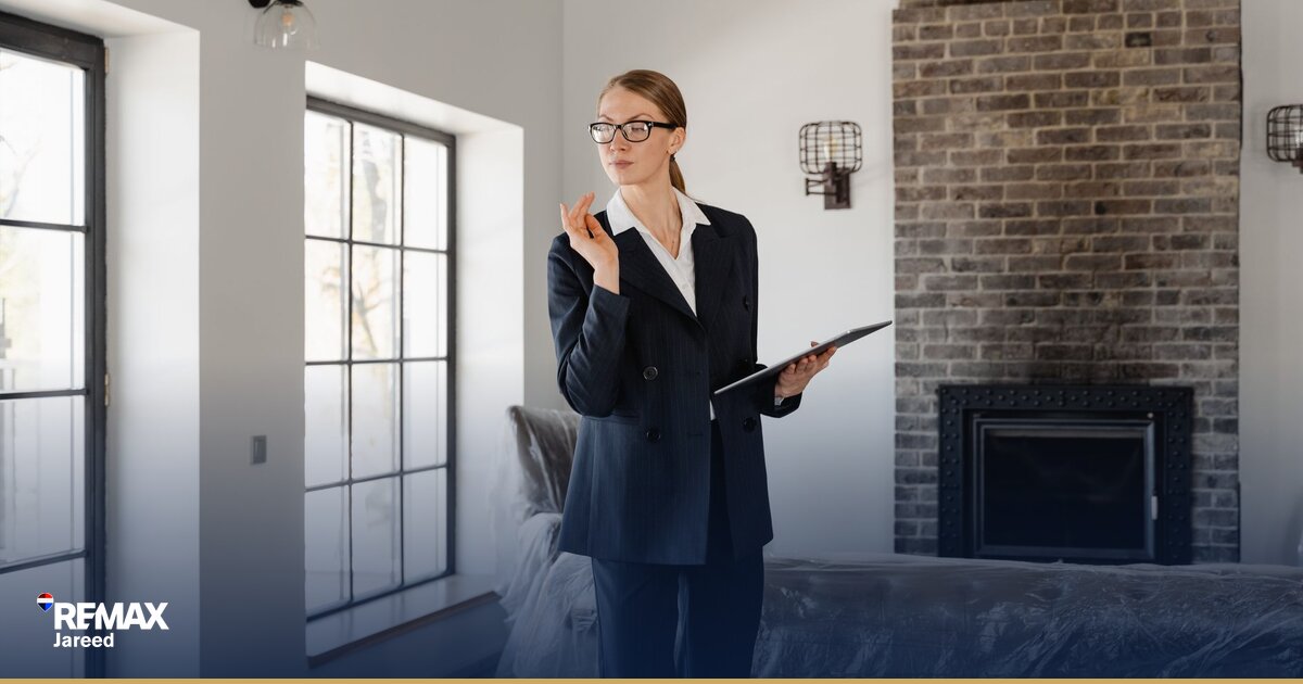 Real estate professional reviewing property listings in modern West Cairo brokerage office