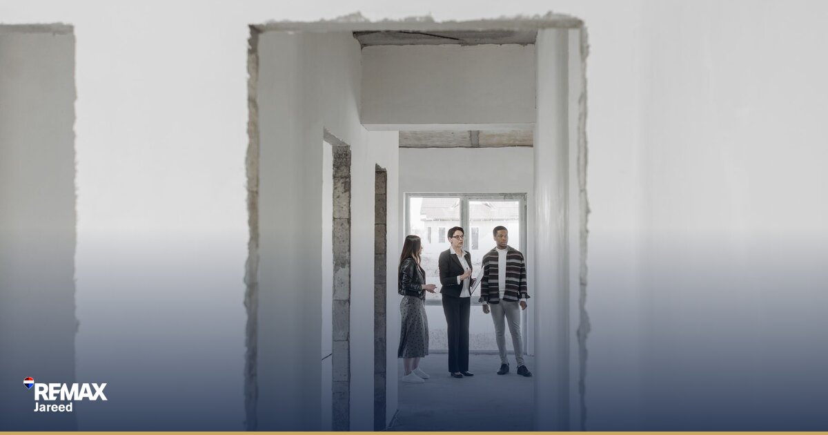 New property consultant reviewing materials during structured onboarding at modern real estate office in West Cairo