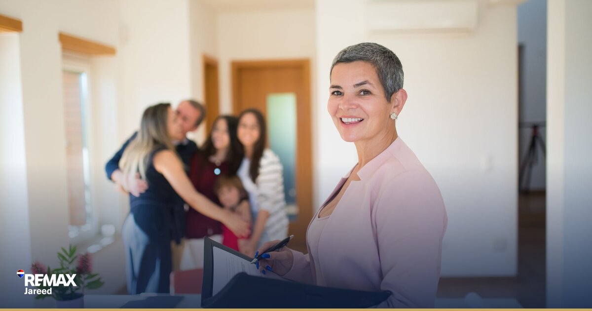 calculator and financial documents showing commission split calculations for real estate agents