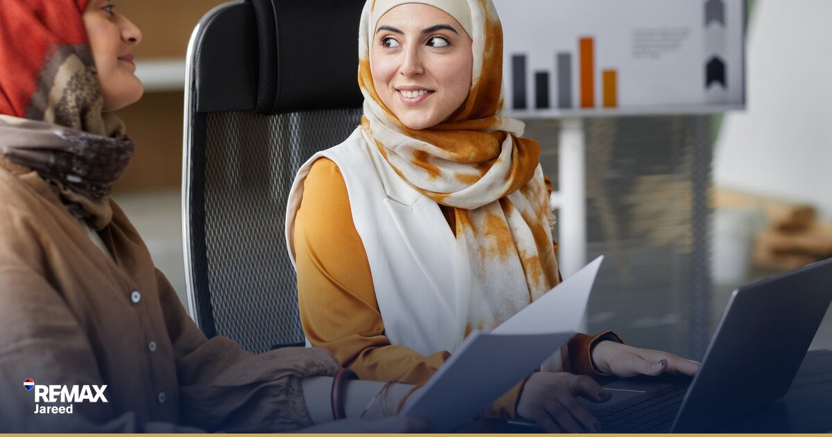 Property consultant and seller reviewing commission agreement and listing contract for West Cairo real estate transaction