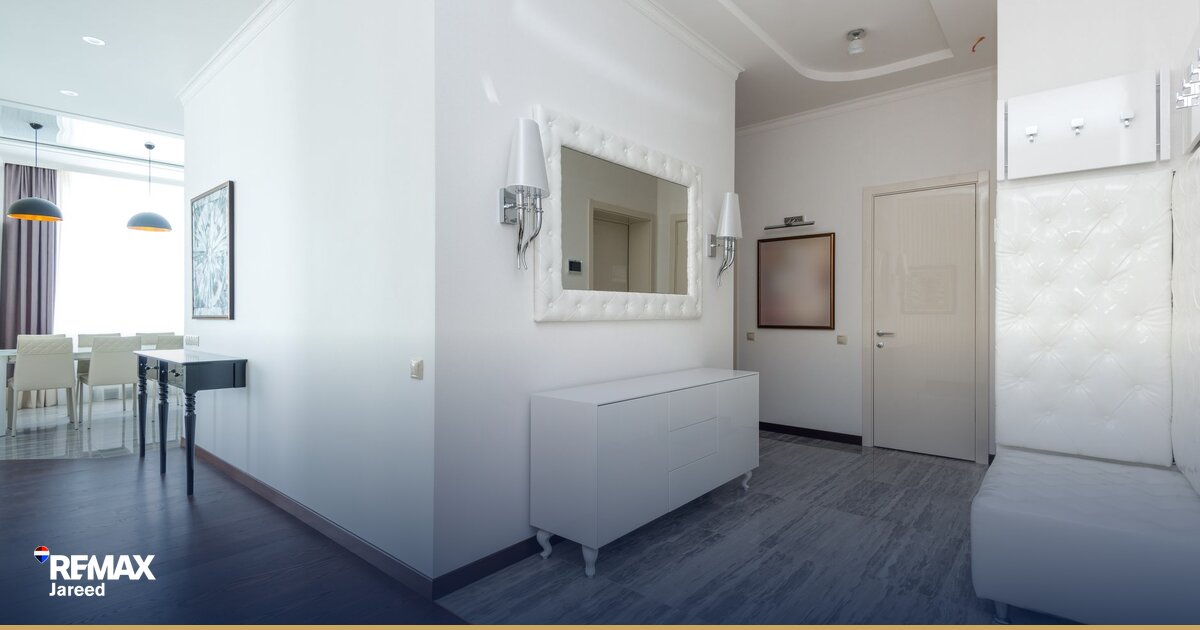 homeowner inspecting new apartment unit during handover with checklist and camera in modern Egyptian compound