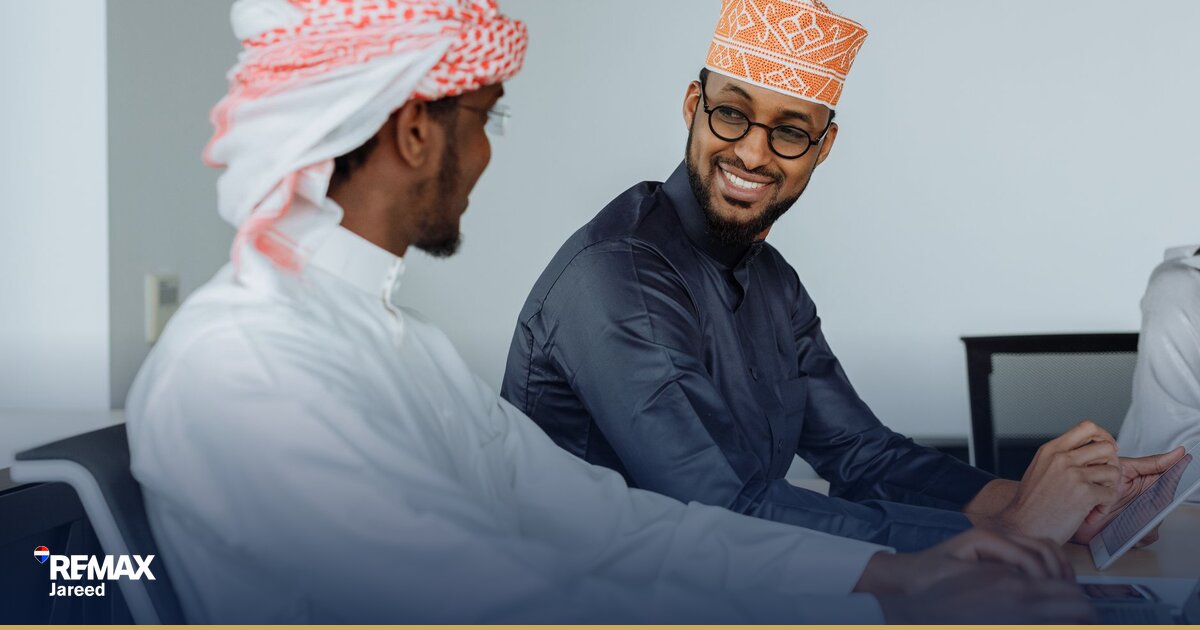 Professional real estate consultant reviewing property listings and client pipeline in modern West Cairo office