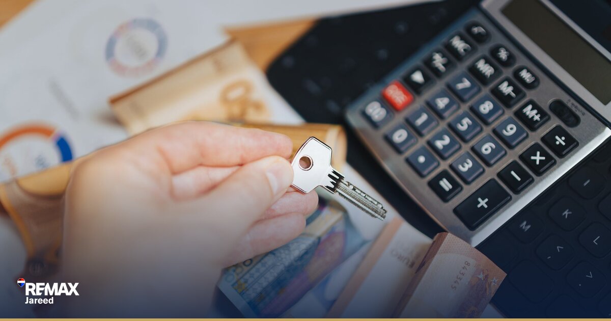 Real estate transaction documents and keys on desk representing property liquidity and time-to-exit in West Cairo markets