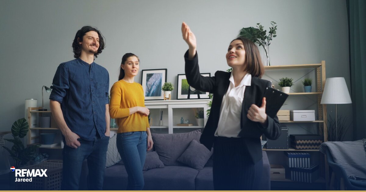 Professional real estate agents in modern office discussing career opportunities and commission structures
