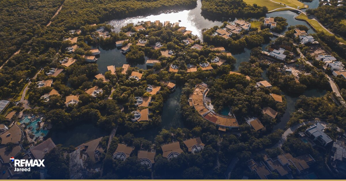 Aerial view of Palm Hills October residential compound with green landscaping and modern apartment buildings in 6th October City