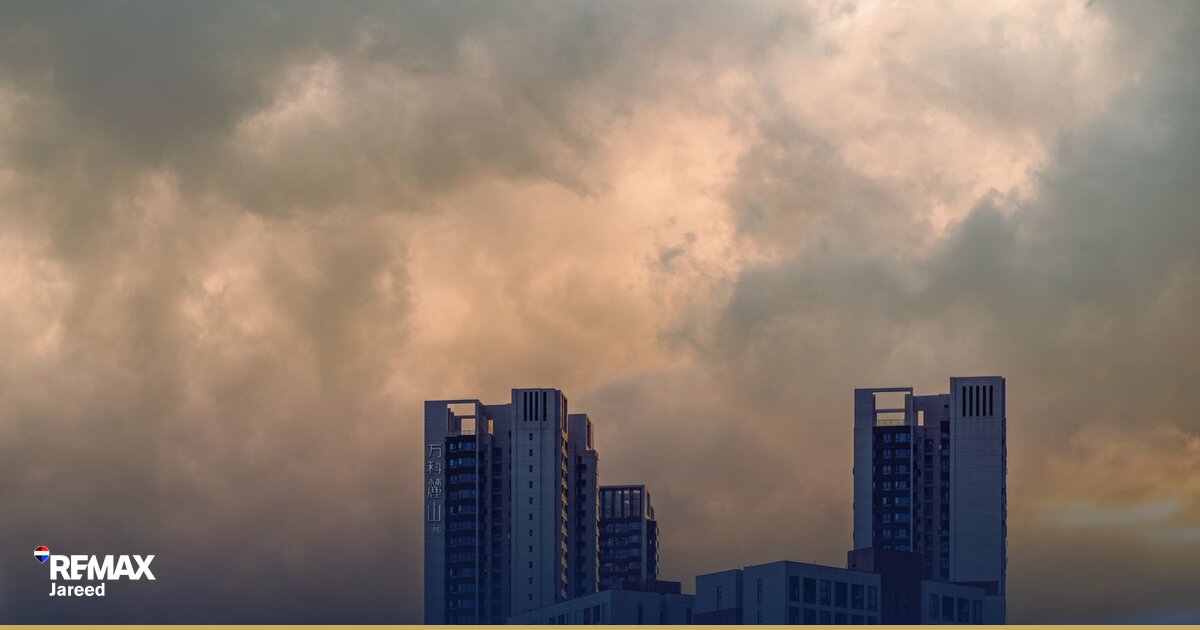 High-rise residential construction site with tower cranes in West Cairo Egypt illustrating off-plan development risk