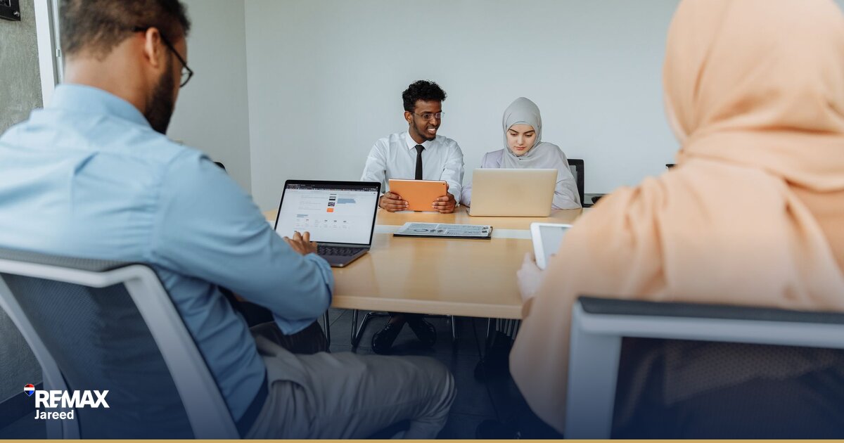 Property consultant reviewing market data and listings in modern office setting