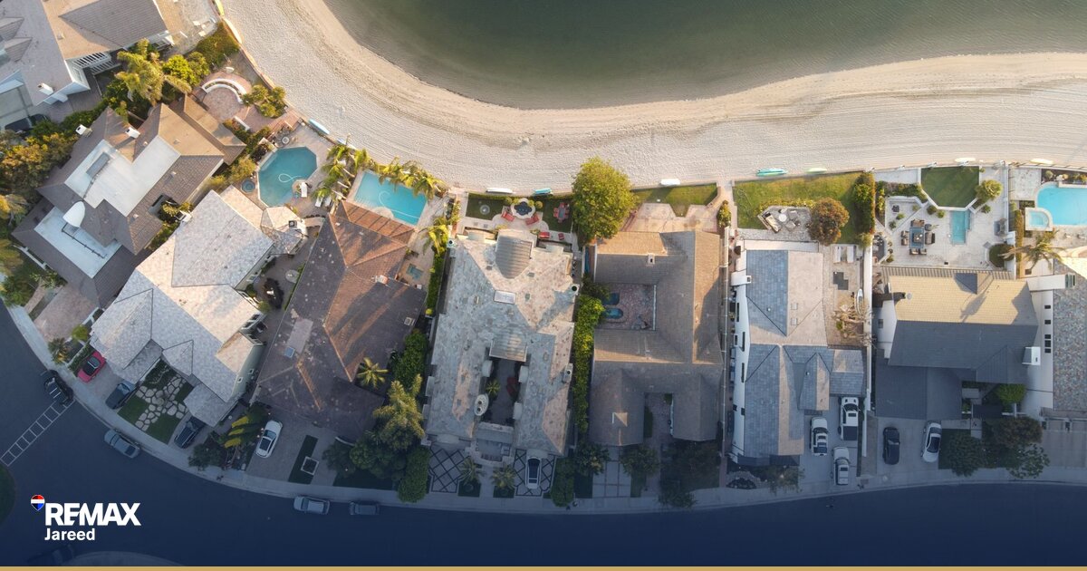 Family-friendly residential compound in Sheikh Zayed with villas, green spaces, swimming pool, and children's play area