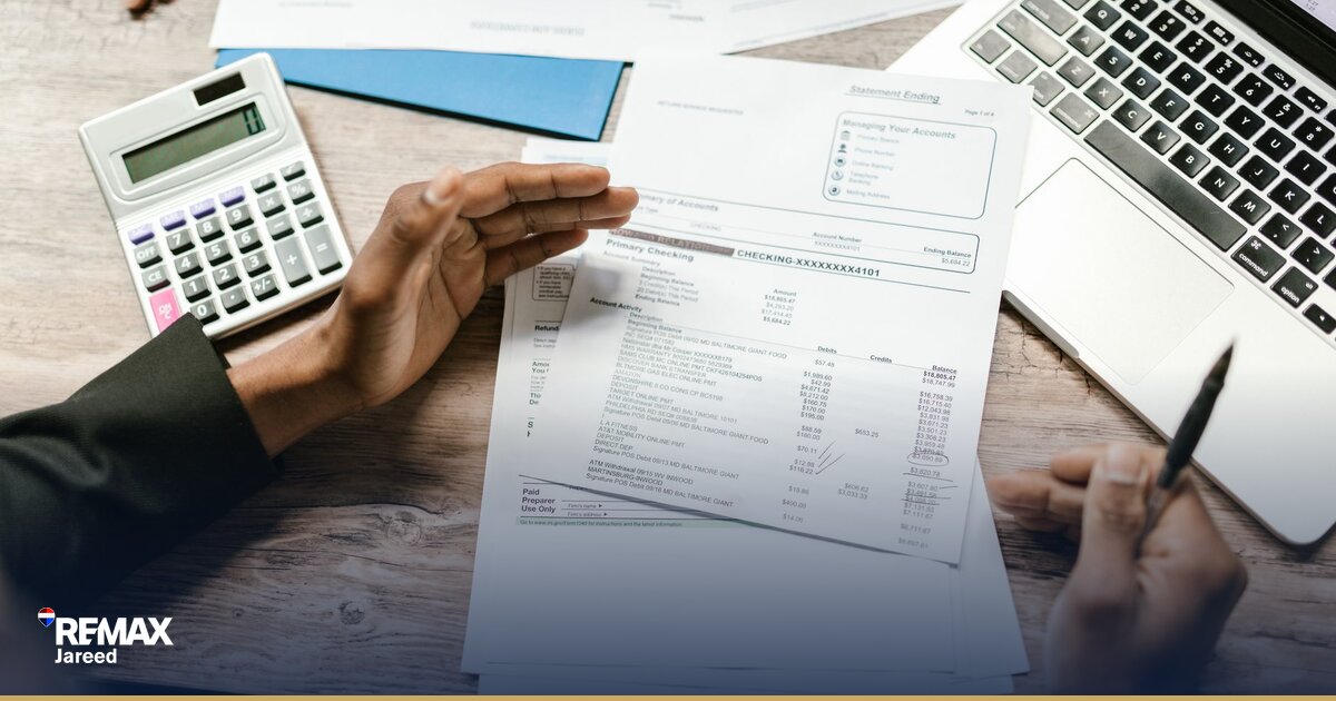 Egyptian family reviewing mortgage documents with bank officer during home purchase approval process
