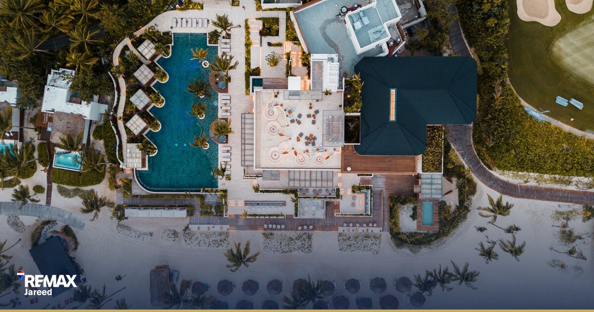 Residential villa with green garden and mature trees in gated compound Sheikh Zayed Egypt