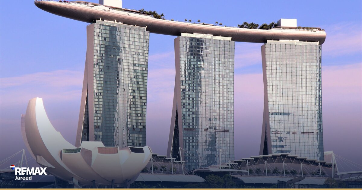 Contemporary residential towers under construction in Sheikh Zayed with completed buildings in background, illustrating off-plan versus ready property comparison