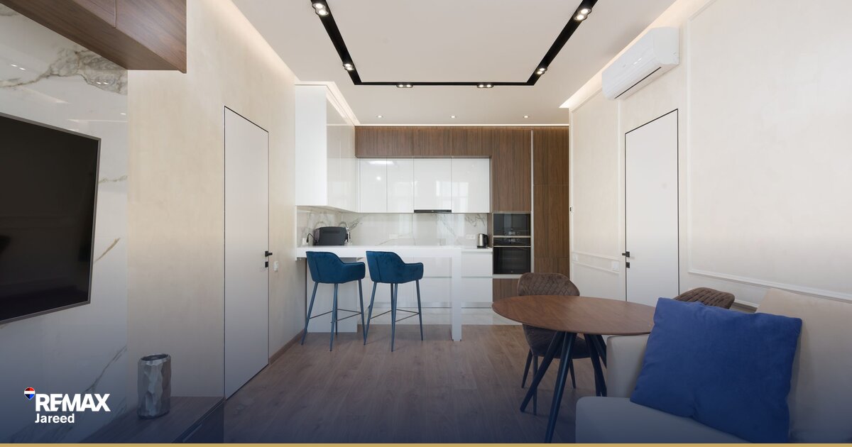 Paint brush and repair tools on white surface symbolizing pre-sale property preparation decisions